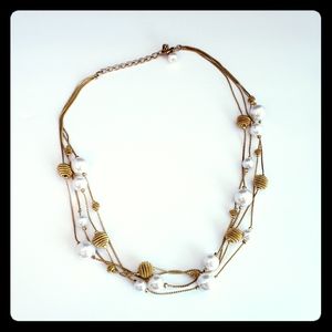 Goldtone multistrand faux pearl necklace